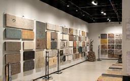 Modern tile showroom with various tiles displayed
